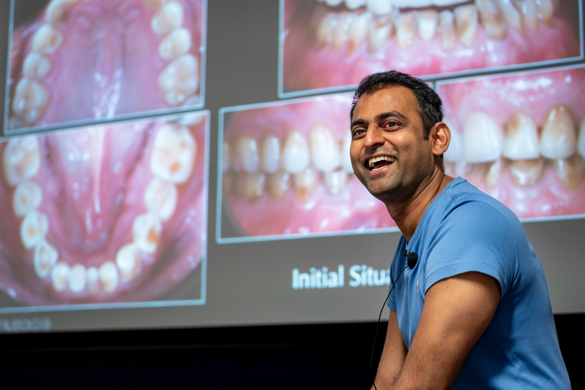 Dr Sid Kothari speaking with dentists during a prosthodontics course